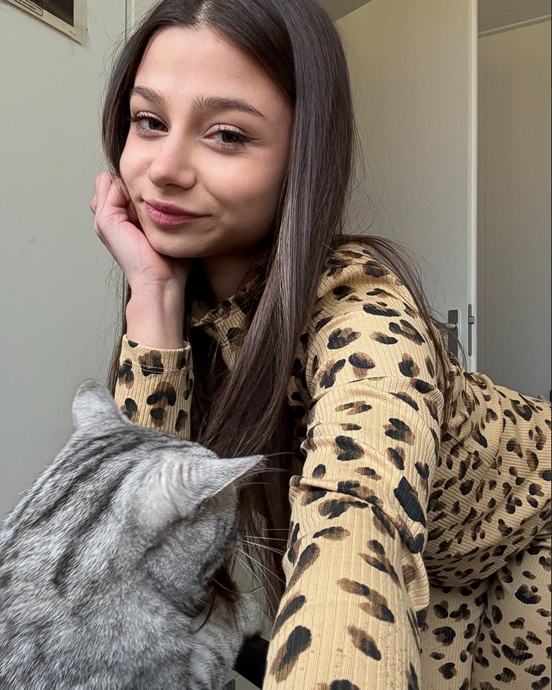 Smiling with a silver cat